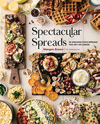 A cover image of the book titled 'Spectacular Spreads' showing a table laid out with various food spreads and platters, ready for a party or gathering.